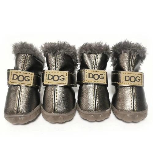 Four brown leather dog boots with grey fur lining, adjustable straps, and non-slip soles.
